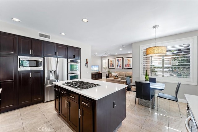 kitchen featuring stainless steel appliances, recessed lighting, light tile patterned floors, and visible vents