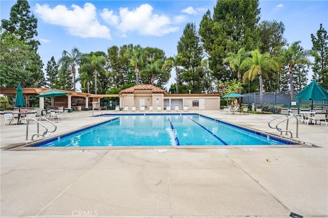 12475 Woodhall Way, Tustin, CA 92782 - community pool featuring a patio and fence