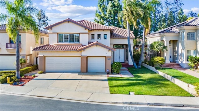 12475 Woodhall Way, Tustin, CA 92782 - mediterranean / spanish home with a tile roof, a garage, stucco siding, concrete driveway, and a front lawn
