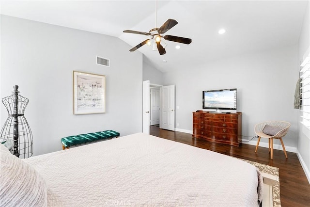bedroom with a ceiling fan, vaulted ceiling, visible vents, wood finished floors, and baseboards