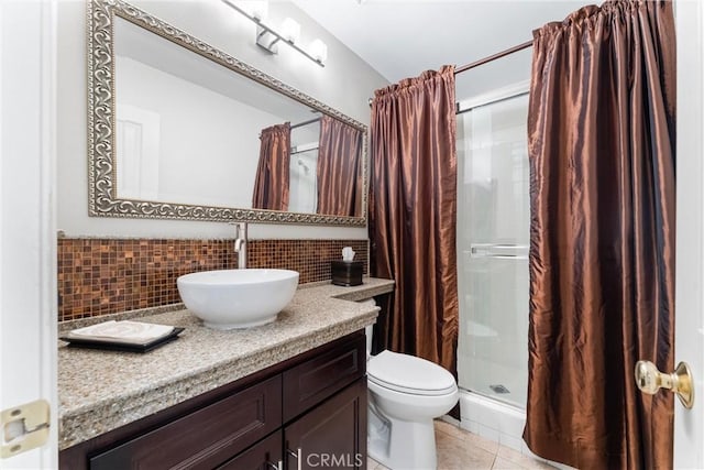 12475 Woodhall Way, Tustin, CA 92782 - full bathroom with tasteful backsplash, a shower stall, tile patterned floors, vanity, and toilet