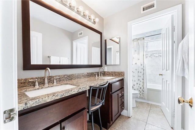 12475 Woodhall Way, Tustin, CA 92782 - full bath featuring toilet, tile patterned flooring, double vanity, and shower / bath combo with shower curtain