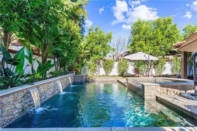 12475 Woodhall Way, Tustin, CA 92782 - view of pool with a hot tub and a fenced backyard