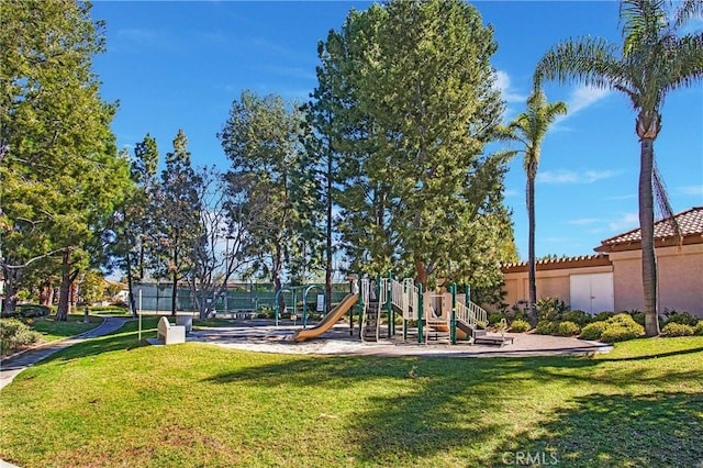 community playground featuring a yard