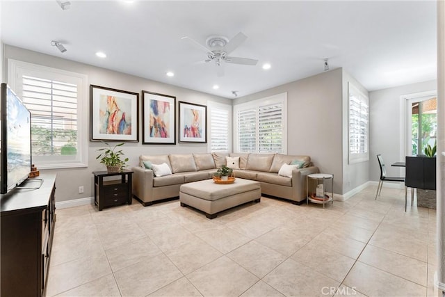 living room with recessed lighting, light tile patterned floors, baseboards, and a ceiling fan