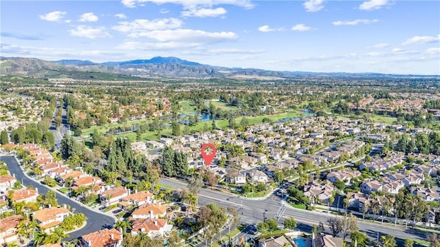 12475 Woodhall Way, Tustin, CA 92782 - aerial view of property's location featuring a mountain backdrop and nearby suburban area