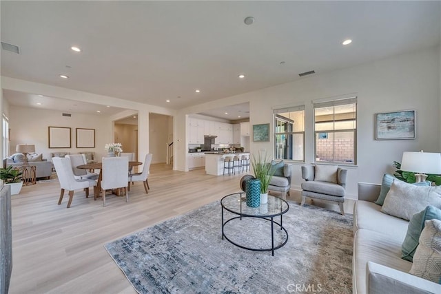 6014 Amora Dr, Chino Hills, CA 91709 - living room featuring light wood-style floors, recessed lighting, and visible vents