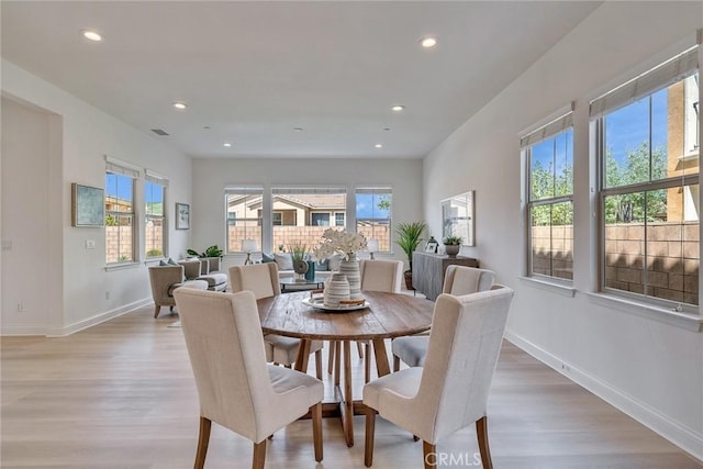 6014 Amora Dr, Chino Hills, CA 91709 - dining space with light wood-style flooring, baseboards, and a healthy amount of sunlight