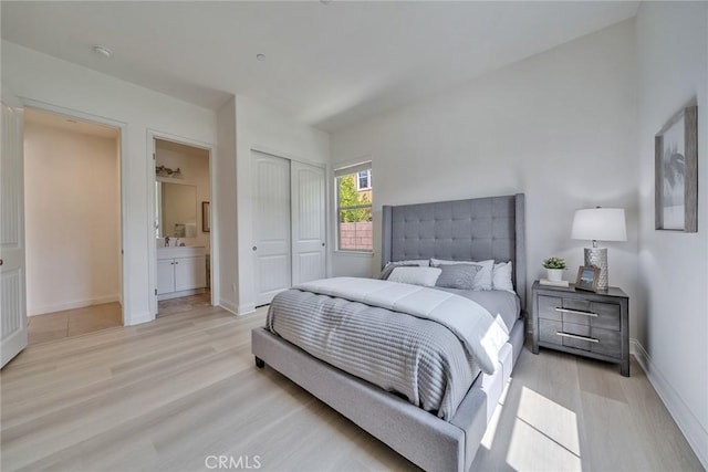 6014 Amora Dr, Chino Hills, CA 91709 - bedroom with light wood finished floors, a closet, and baseboards
