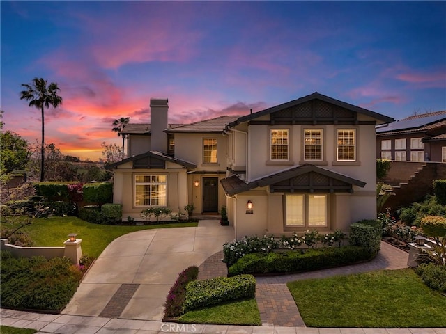 608 Chaparral Ct, Altadena, CA 91001 - view of front of home featuring a chimney, a yard, driveway, and stucco siding