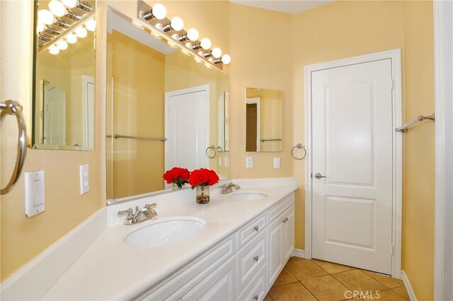 608 Chaparral Ct, Altadena, CA 91001 - full bathroom with double vanity, a sink, baseboards, and tile patterned floors