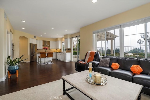 608 Chaparral Ct, Altadena, CA 91001 - living room with recessed lighting, arched walkways, baseboards, and dark wood-type flooring