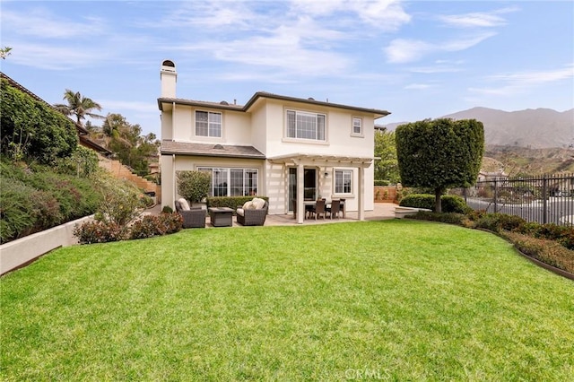 608 Chaparral Ct, Altadena, CA 91001 - back of house featuring a yard, a patio, fence, and stucco siding