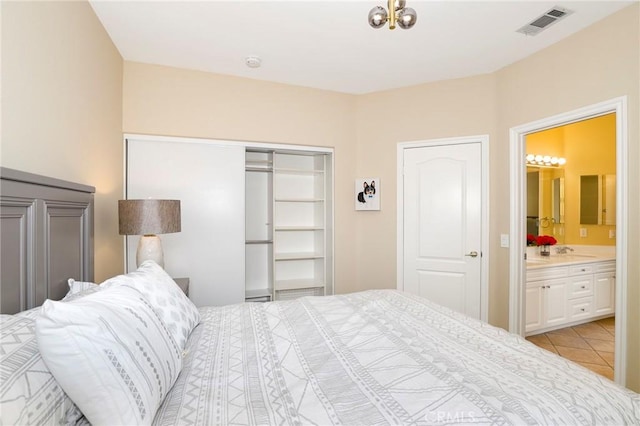 608 Chaparral Ct, Altadena, CA 91001 - bedroom featuring ensuite bathroom, a closet, light tile patterned flooring, and visible vents
