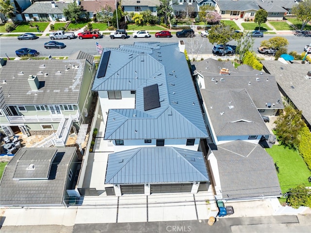 birds eye view of property with a residential view