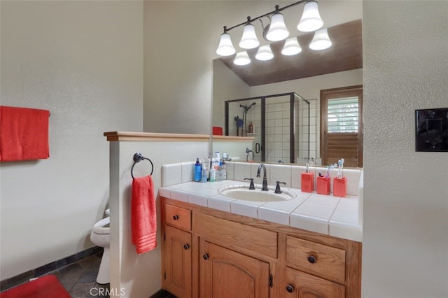 40957 Shandee Ln, Ahwahnee, CA 93601 - full bath featuring tile patterned floors, toilet, a stall shower, and vanity