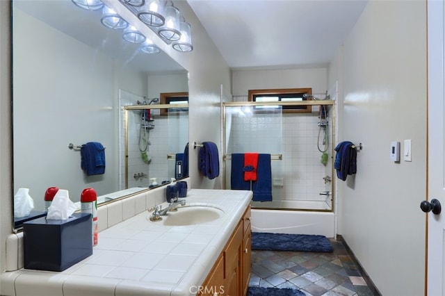 40957 Shandee Ln, Ahwahnee, CA 93601 - full bath with enclosed tub / shower combo, vanity, and baseboards