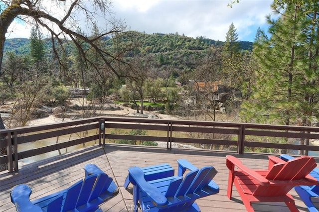 40957 Shandee Ln, Ahwahnee, CA 93601 - wooden terrace featuring a forest view
