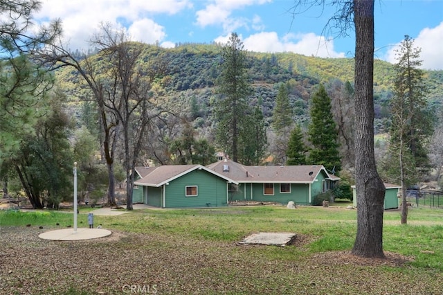 40957 Shandee Ln, Ahwahnee, CA 93601 - rear view of house with a yard and a view of trees