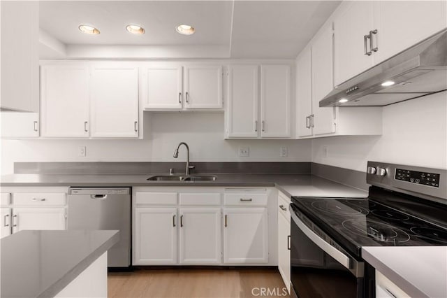 1651 S Juniper Unit 217, Escondido, CA 92025 - kitchen featuring appliances with stainless steel finishes, a sink, under cabinet range hood, white cabinetry, and recessed lighting