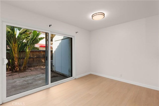 1651 S Juniper Unit 217, Escondido, CA 92025 - unfurnished room with wood finished floors and baseboards