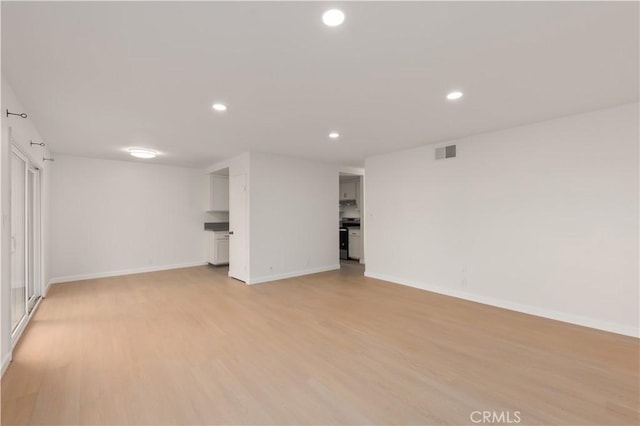 1651 S Juniper Unit 217, Escondido, CA 92025 - below grade area featuring light wood-type flooring, recessed lighting, and baseboards