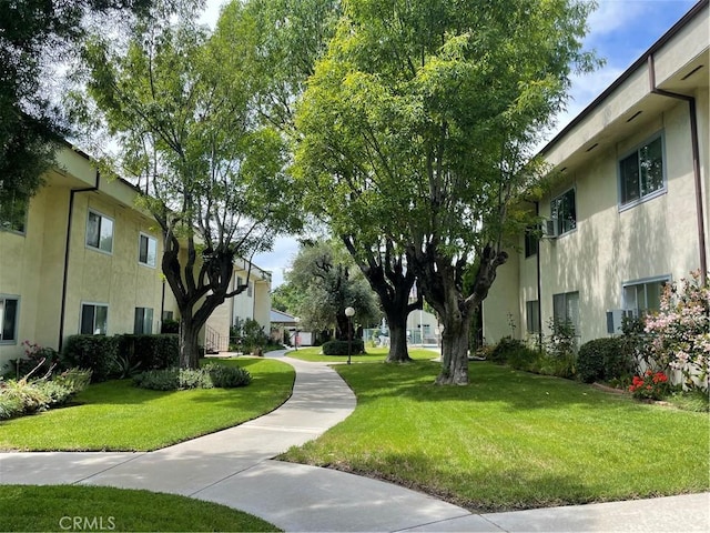 view of home's community featuring a yard
