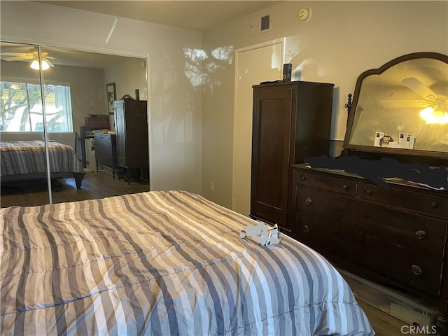bedroom with wood finished floors and visible vents