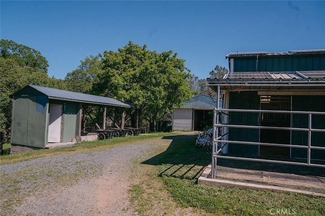 14134 Serpentine Farm Ln, Grass Valley, CA 95949 - exterior space featuring an exterior structure, metal roof, and an outbuilding