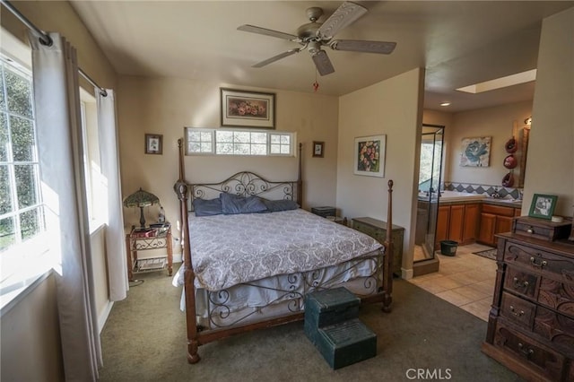 14134 Serpentine Farm Ln, Grass Valley, CA 95949 - bedroom featuring light tile patterned floors, ensuite bathroom, light colored carpet, and a ceiling fan