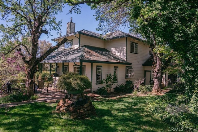 14134 Serpentine Farm Ln, Grass Valley, CA 95949 - rear view of house with a chimney and a yard
