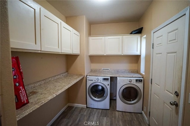 14134 Serpentine Farm Ln, Grass Valley, CA 95949 - washroom with dark wood-type flooring, baseboards, cabinet space, and washer and clothes dryer