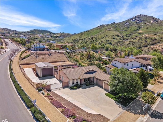 birds eye view of property with a mountain view and a residential view
