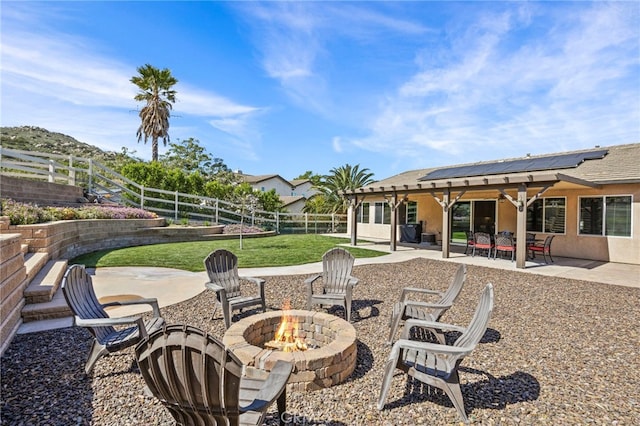 view of patio / terrace with a fire pit and a fenced backyard