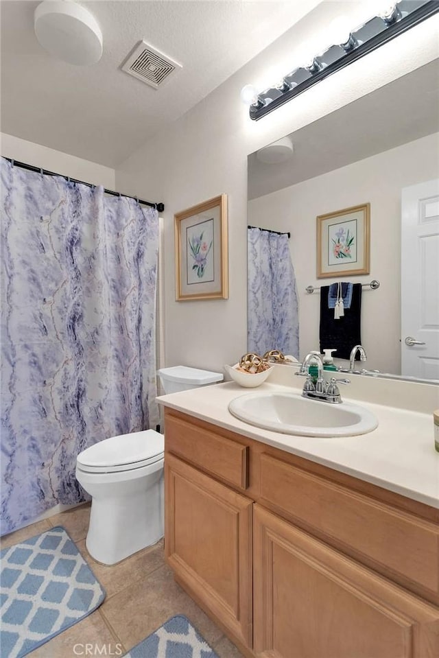 full bath featuring visible vents, toilet, tile patterned flooring, and vanity