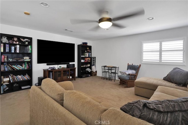 living area featuring recessed lighting, carpet flooring, visible vents, and a ceiling fan