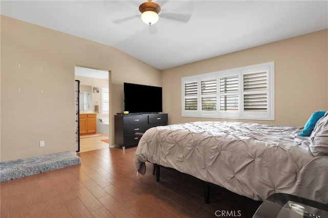 bedroom featuring a ceiling fan, multiple windows, wood finished floors, and lofted ceiling