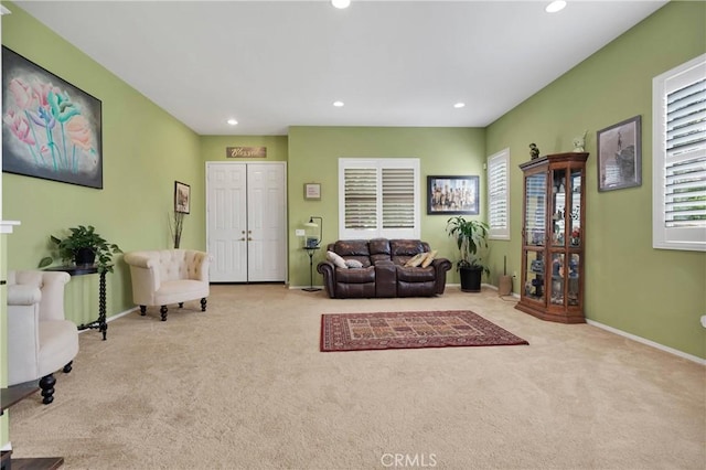 living room with recessed lighting, carpet flooring, and baseboards