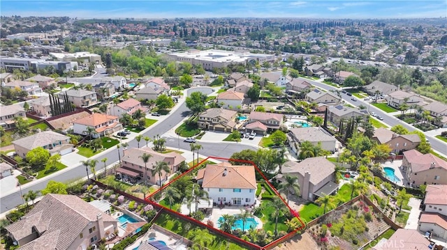 birds eye view of property with a residential view