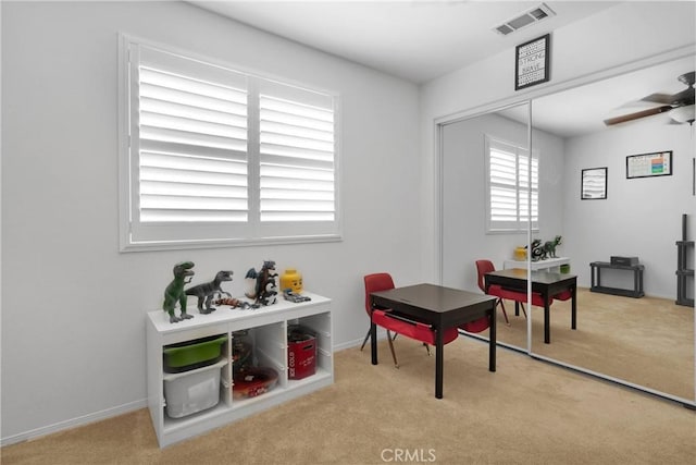 recreation room featuring visible vents, ceiling fan, and carpet flooring