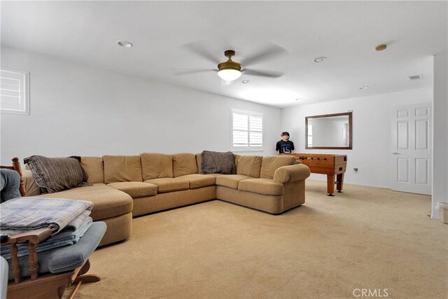 living area with light carpet, recessed lighting, visible vents, and a ceiling fan
