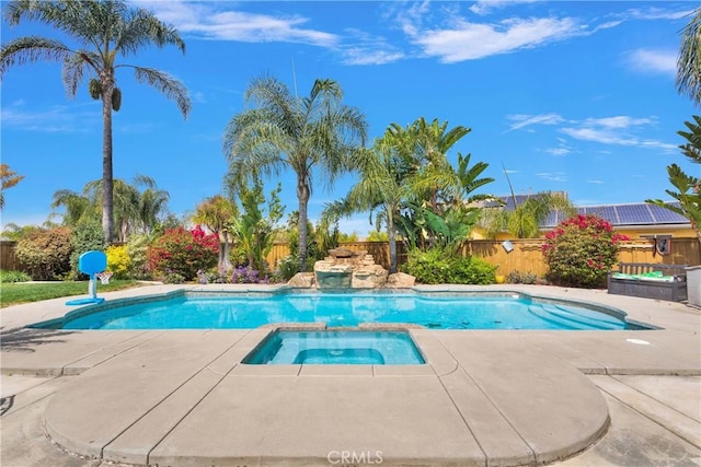 view of pool with a fenced in pool, a patio, fence, and an in ground hot tub