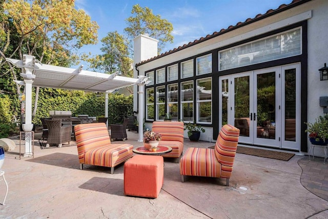 view of patio / terrace with french doors and a pergola