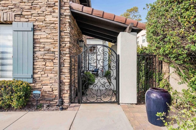 view of gate featuring fence
