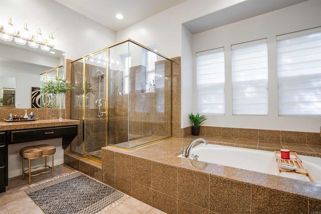 full bath with plenty of natural light, a stall shower, a garden tub, and tile patterned flooring