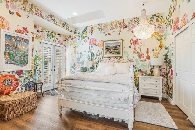 bedroom featuring a closet, access to exterior, hardwood / wood-style floors, and wallpapered walls