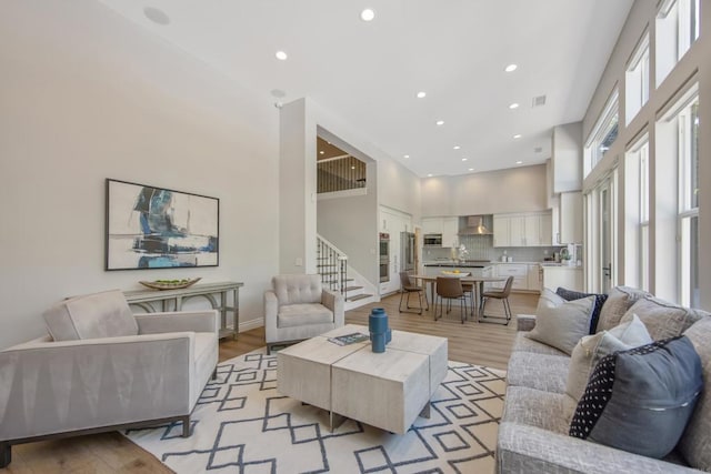 2463 Springbrook St, Thousand Oaks, CA 91362 - living area with a high ceiling, stairway, light wood-style floors, and recessed lighting