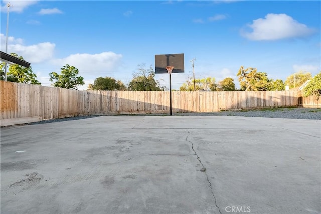 view of sport court featuring a fenced backyard