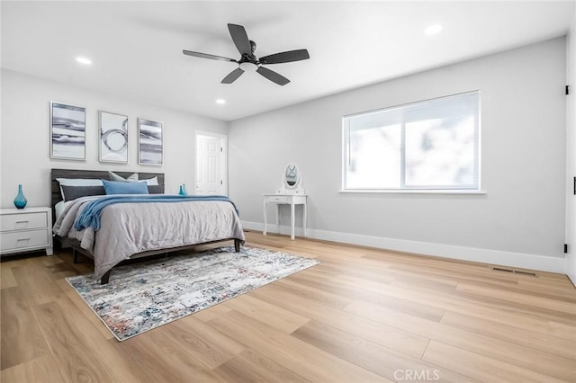bedroom with recessed lighting, baseboards, a ceiling fan, and wood finished floors
