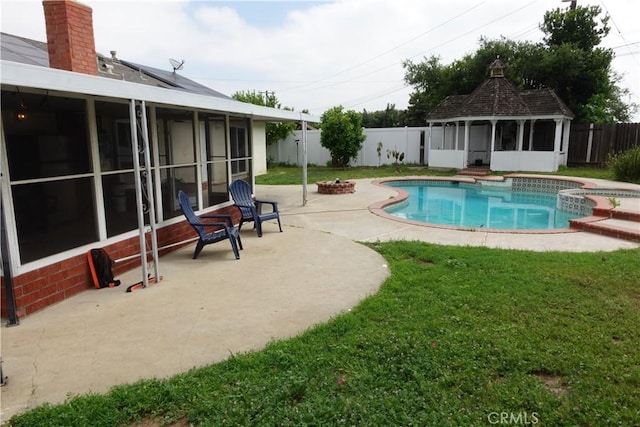 2842 Pietro Dr, Hacienda Heights, CA 91745 - view of pool featuring a sunroom, an outdoor fire pit, a patio area, and a pool with connected hot tub
